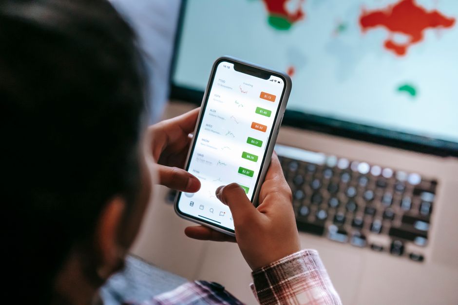 korean person checking finance app on smartphone
