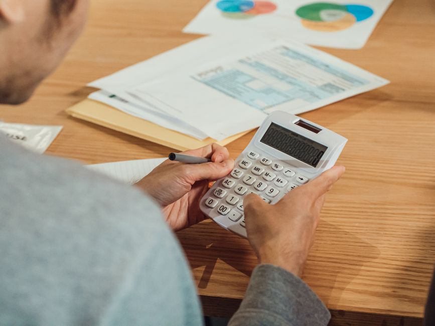 korean person calculating tax with calculator