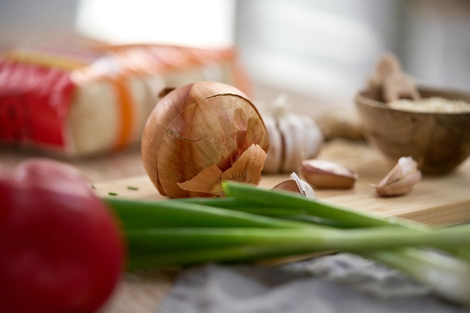 garlic ginger onion on wooden table