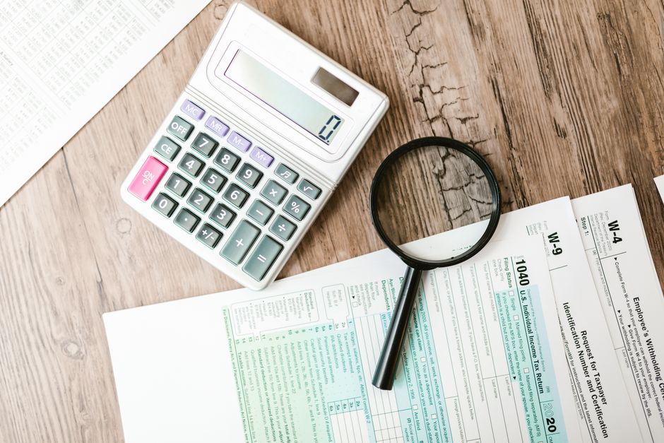 tax calculation document and calculator desk