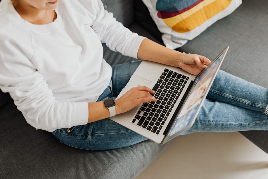 person using laptop at home