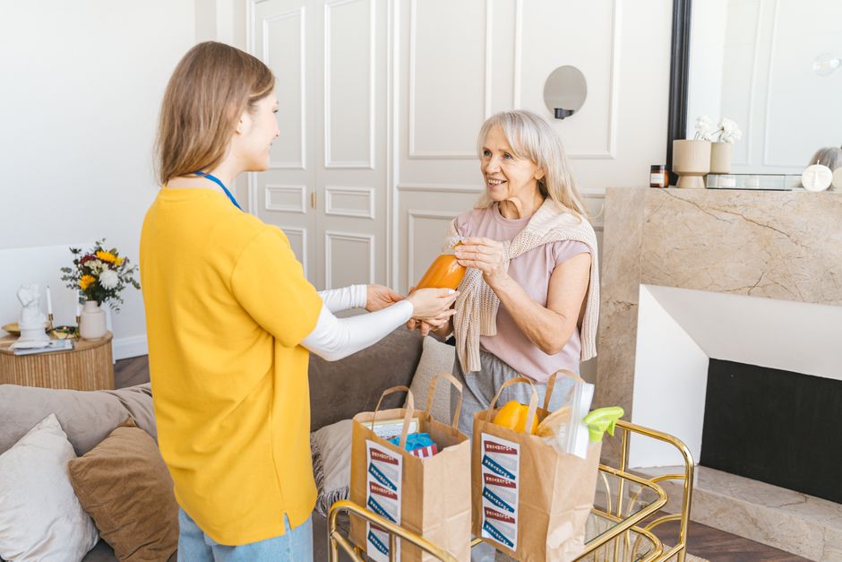 caregiver helping elderly person