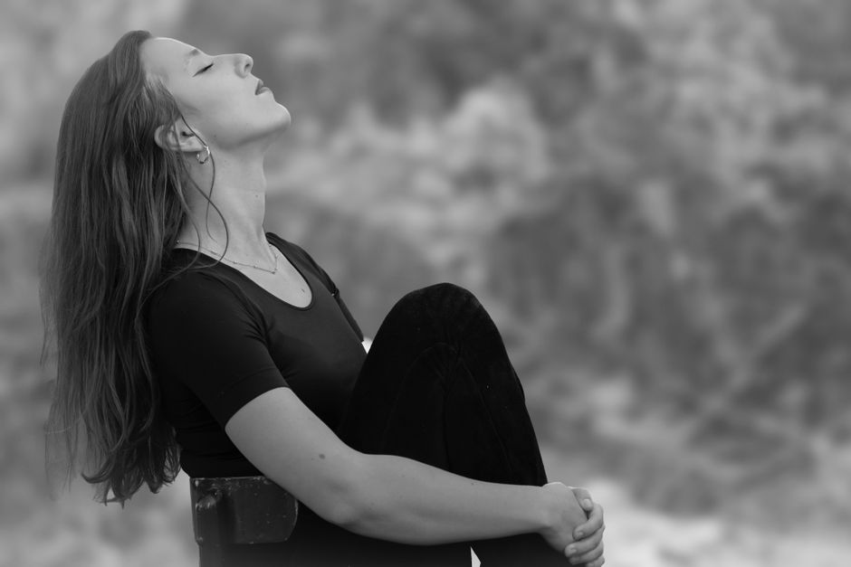 person doing deep breathing relaxation