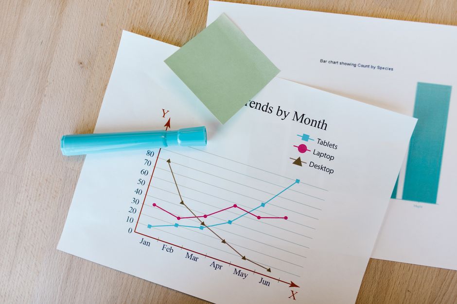 comparison chart documents on desk