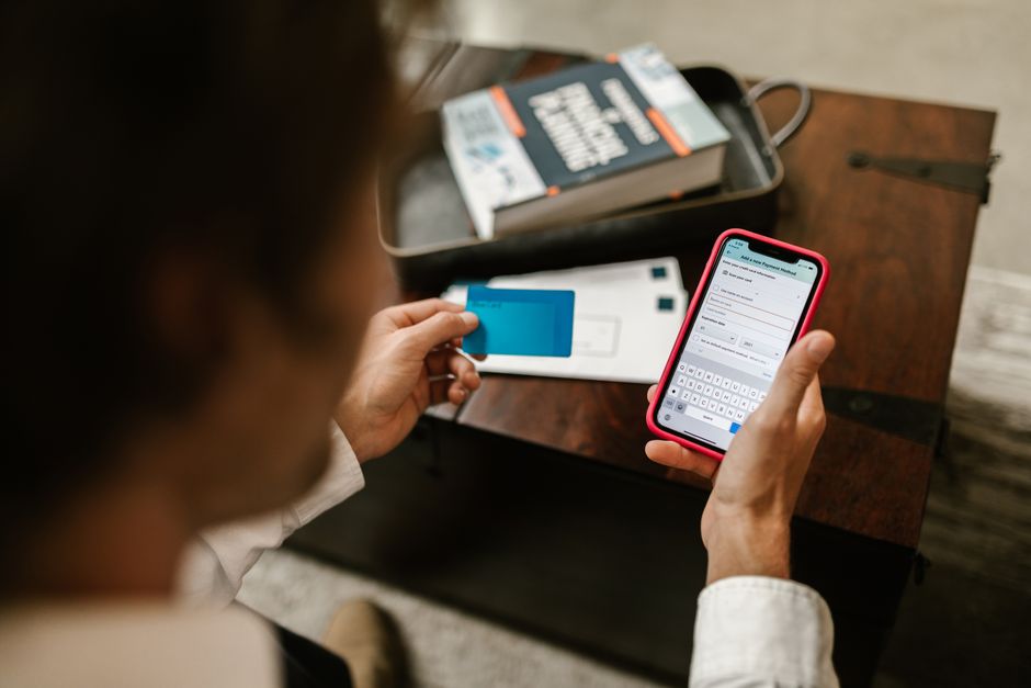 person checking smartphone banking app