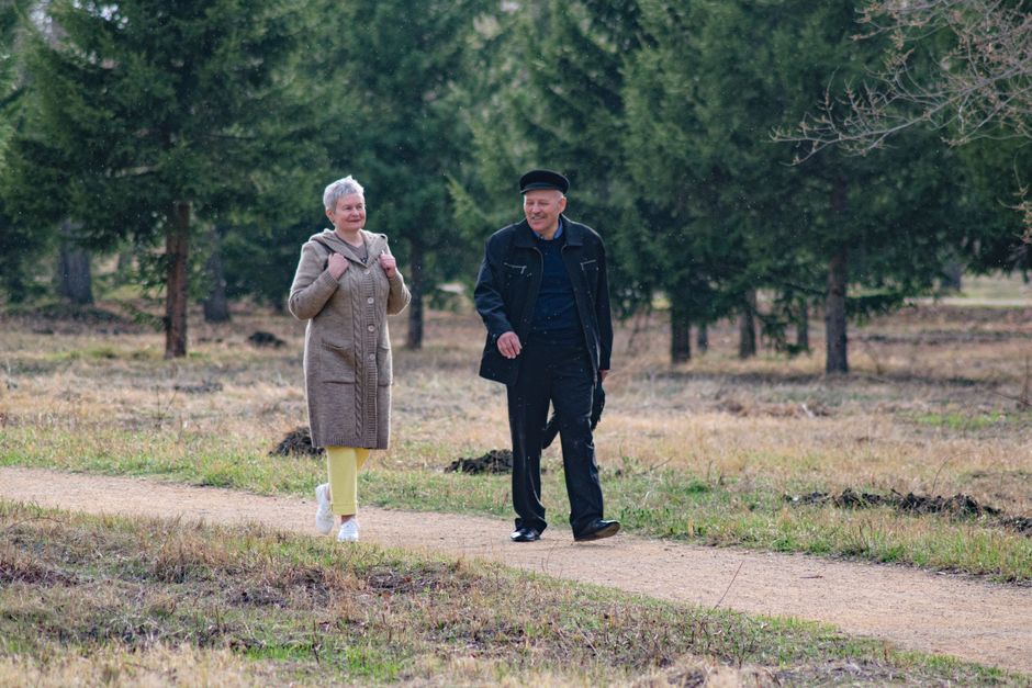 senior couple walking park exercise