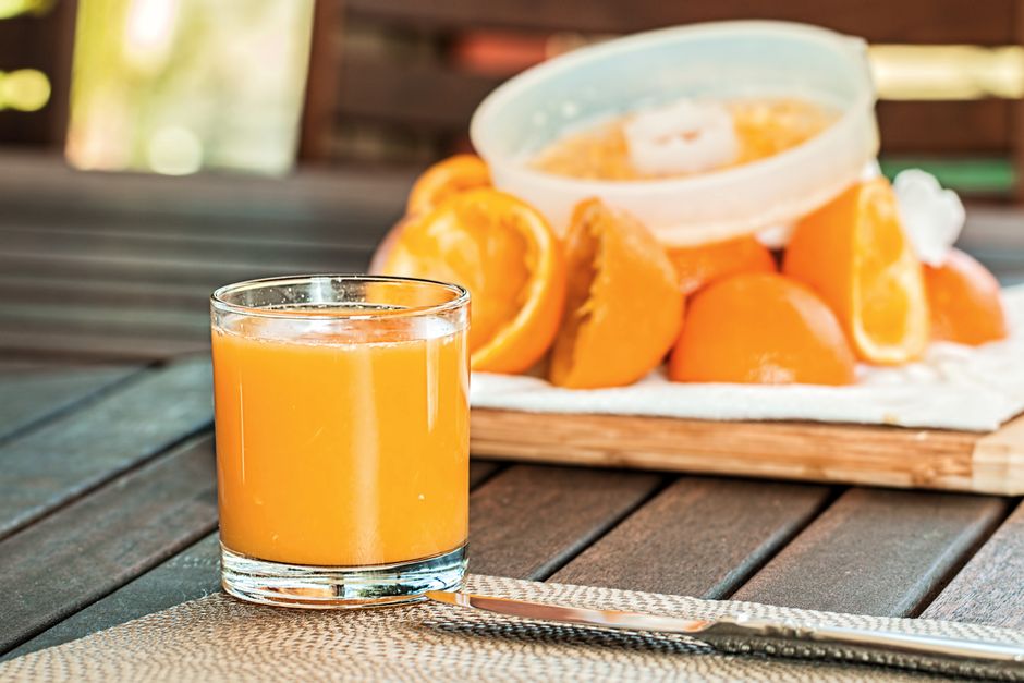 orange juice and fresh fruits on table
