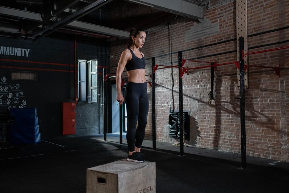 person lifting box bending knees