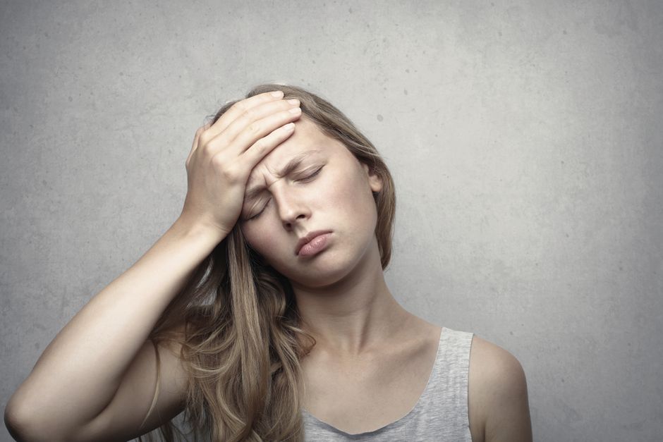 person feeling dizzy heat exhaustion