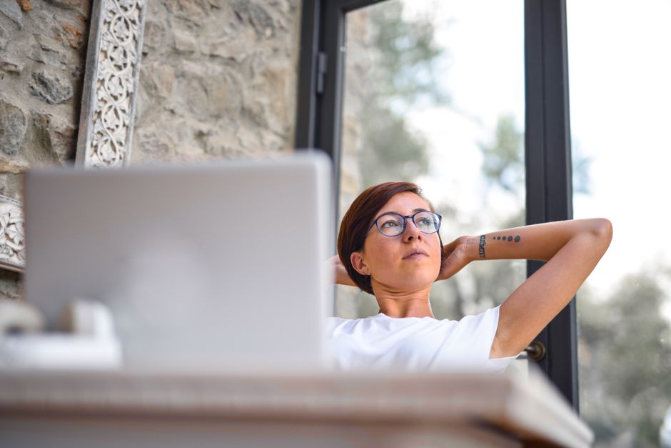 person looking away from screen taking a break