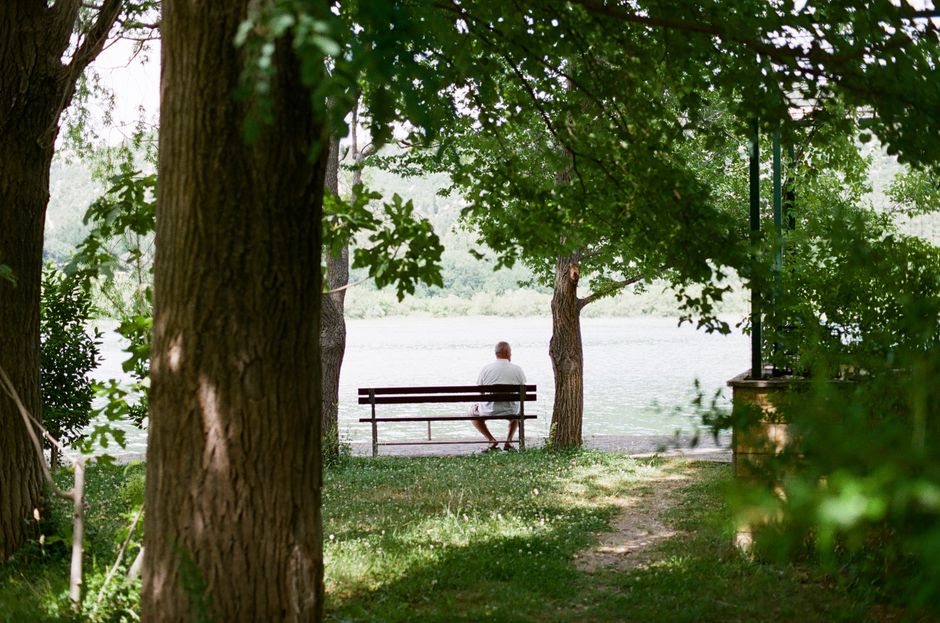 elderly person resting in shade summer