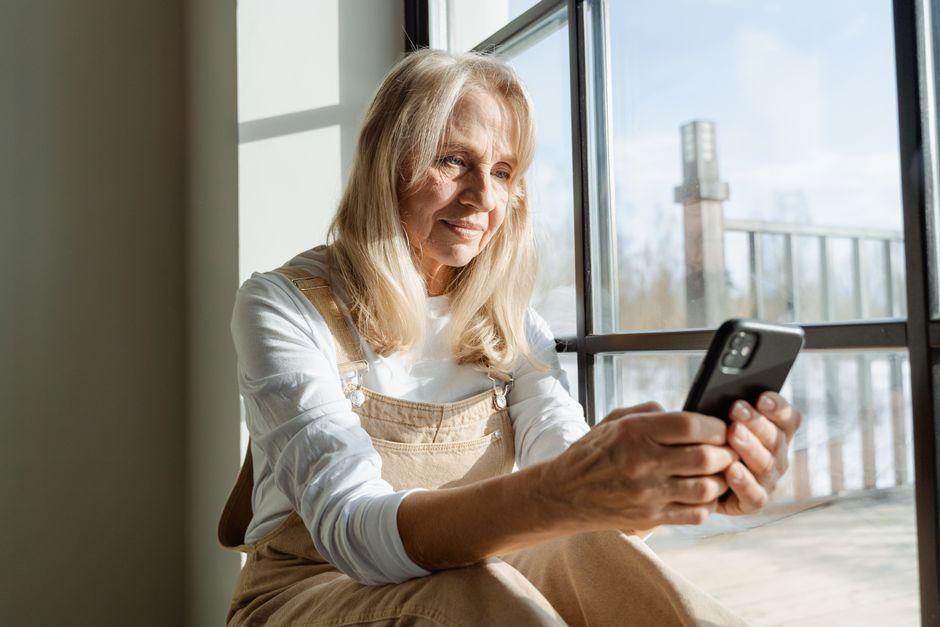 grandparent using smartphone banking app