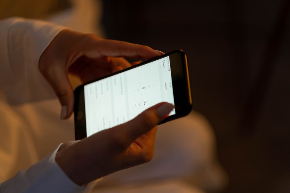 person using smartphone government app