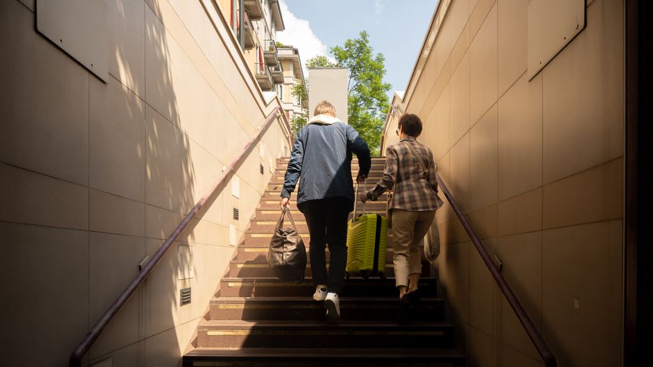 middle aged person climbing stairs tired