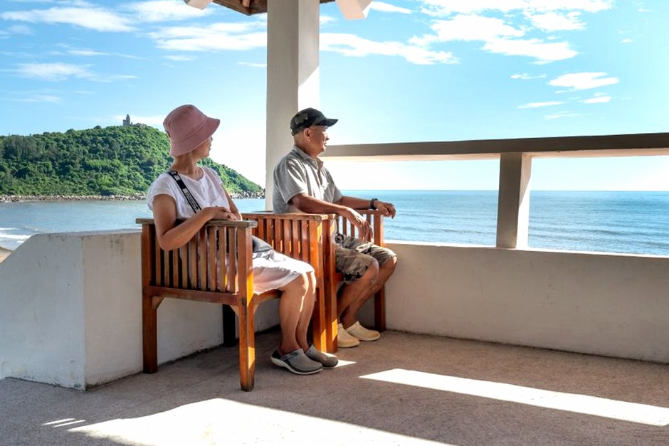 senior couple enjoying beach summer