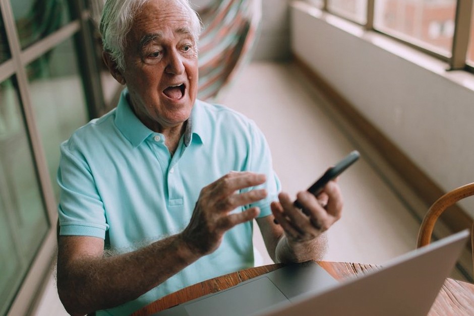 elderly person adjusting smartphone settings