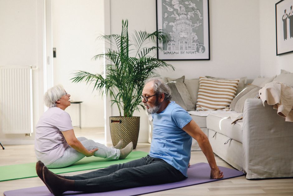 senior woman exercising at home living room