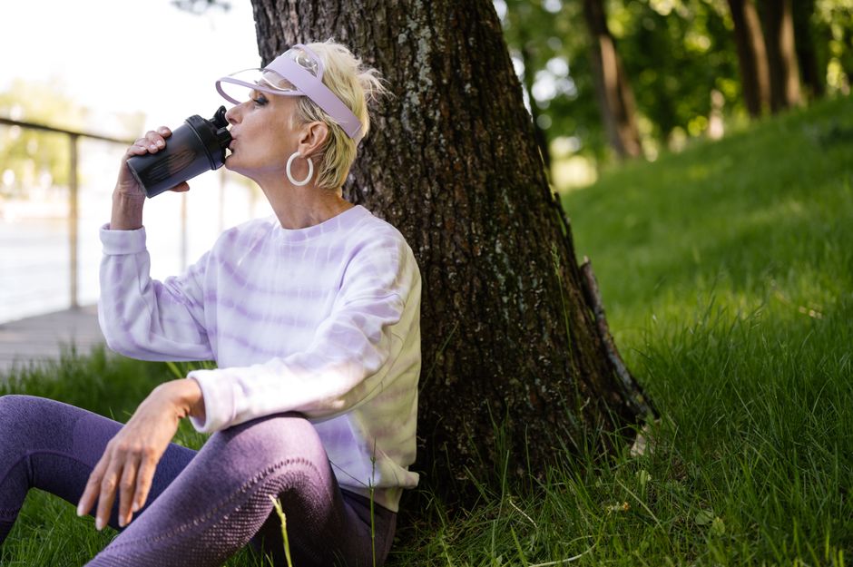 senior korean woman drinking water summer