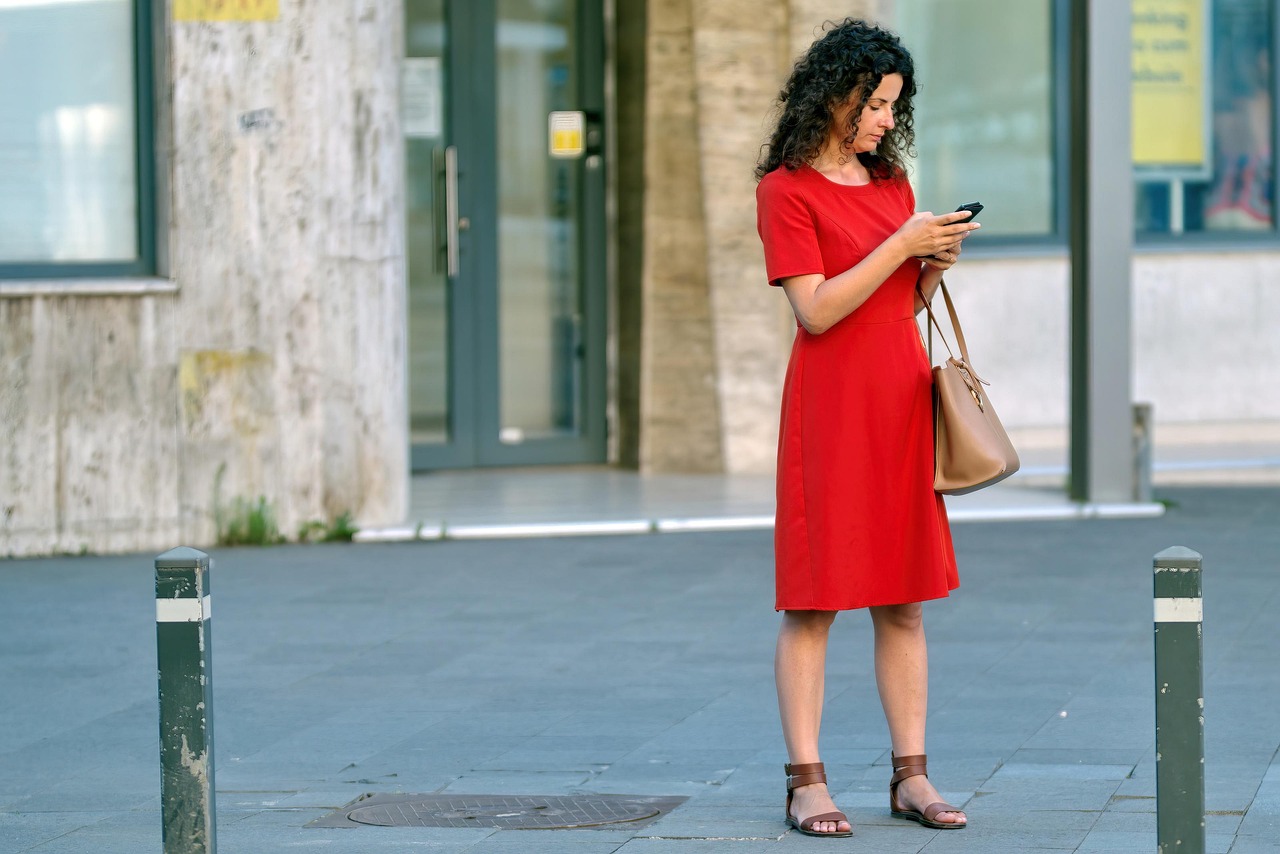 worried person looking at smartphone