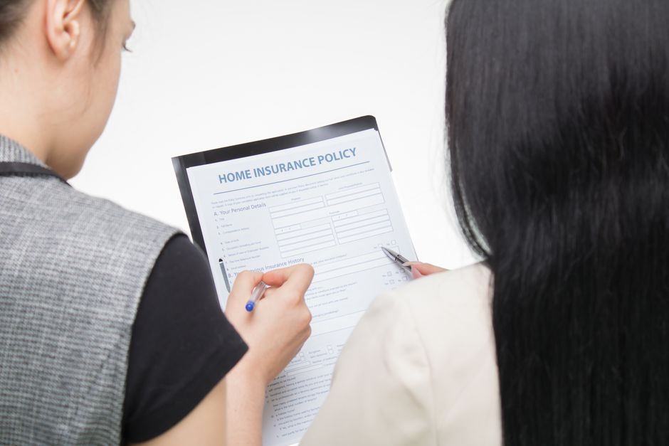 korean family reviewing insurance documents at home