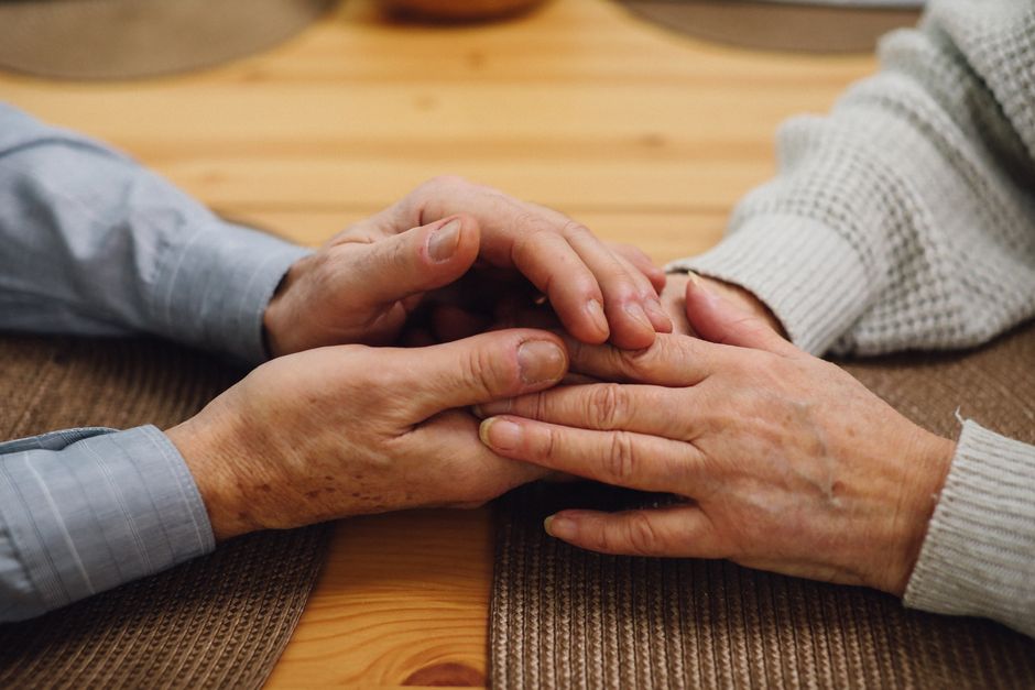 elderly korean couple holding hands