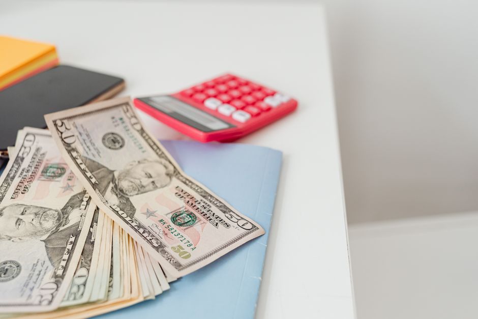 calculator and savings passbook on desk