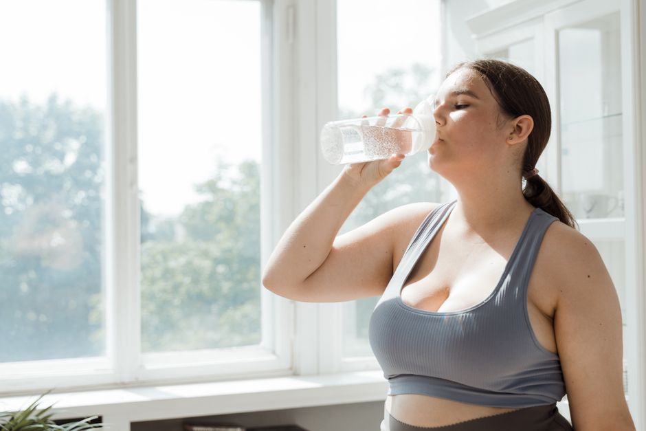 woman drinking water outdoor exercise morning