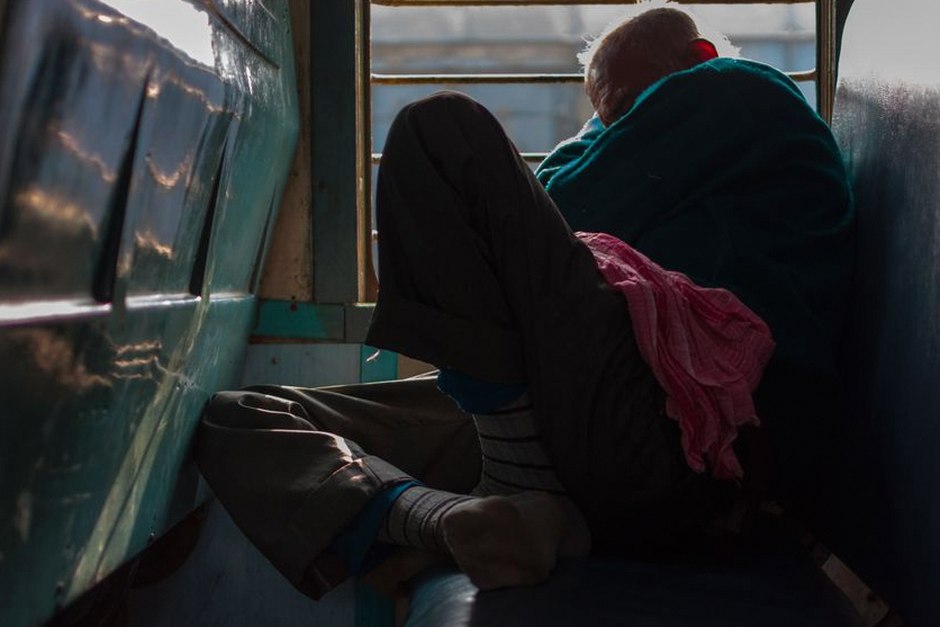 elderly person resting during long journey
