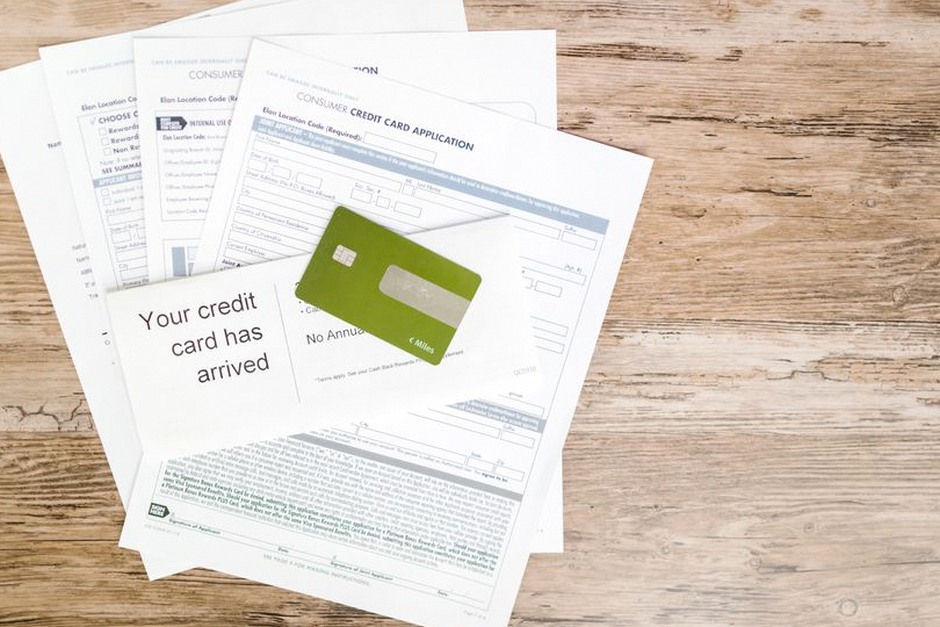 credit card and bank statement on desk