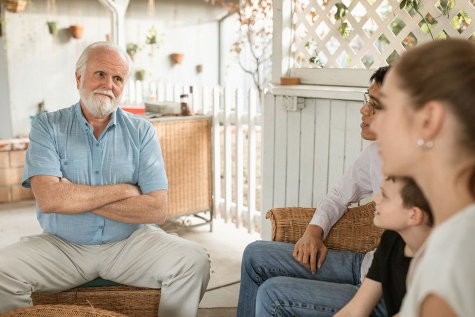 elderly parent and adult child having conversation