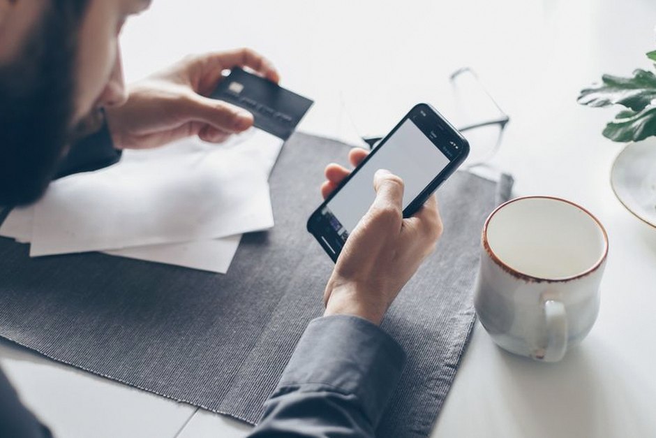 person checking banking app on smartphone