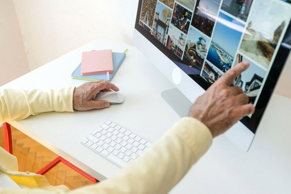 elderly hands using computer mouse