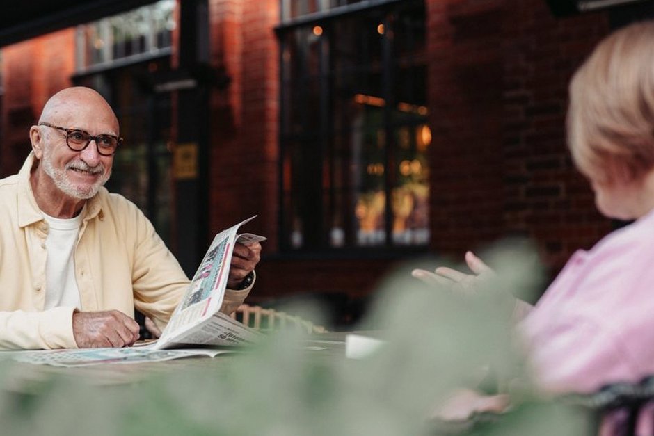 elderly people reading poetry together