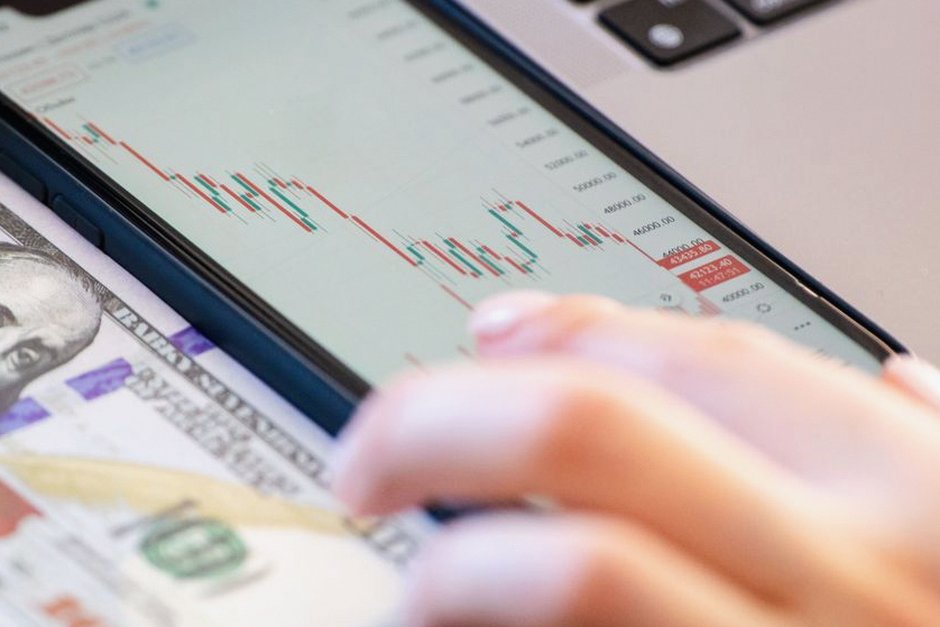 person checking investment portfolio smartphone