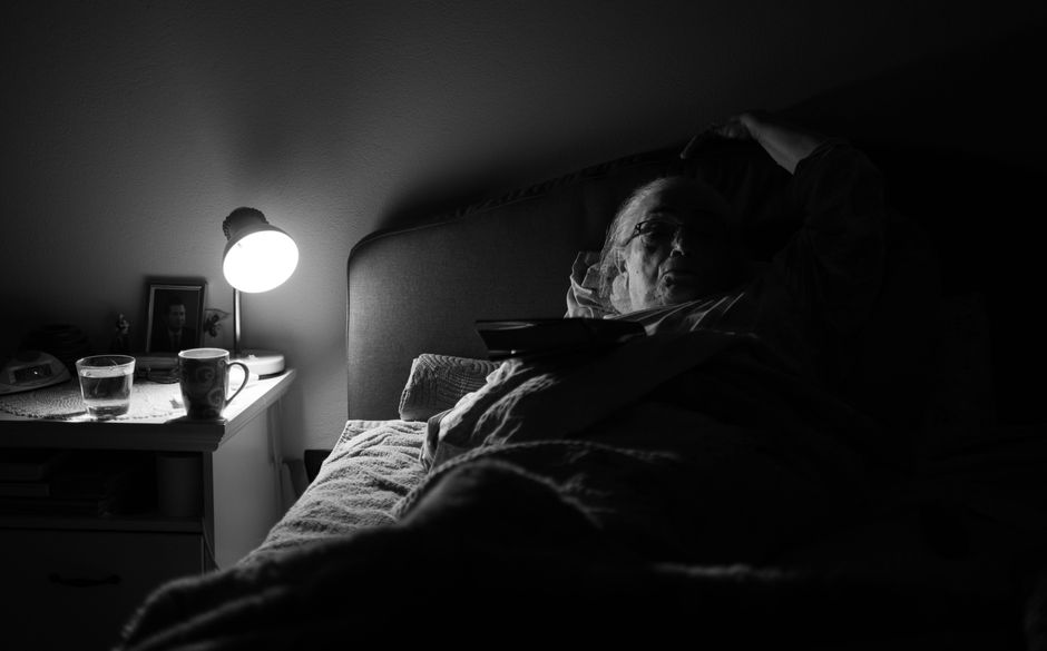 senior citizen resting indoors fan