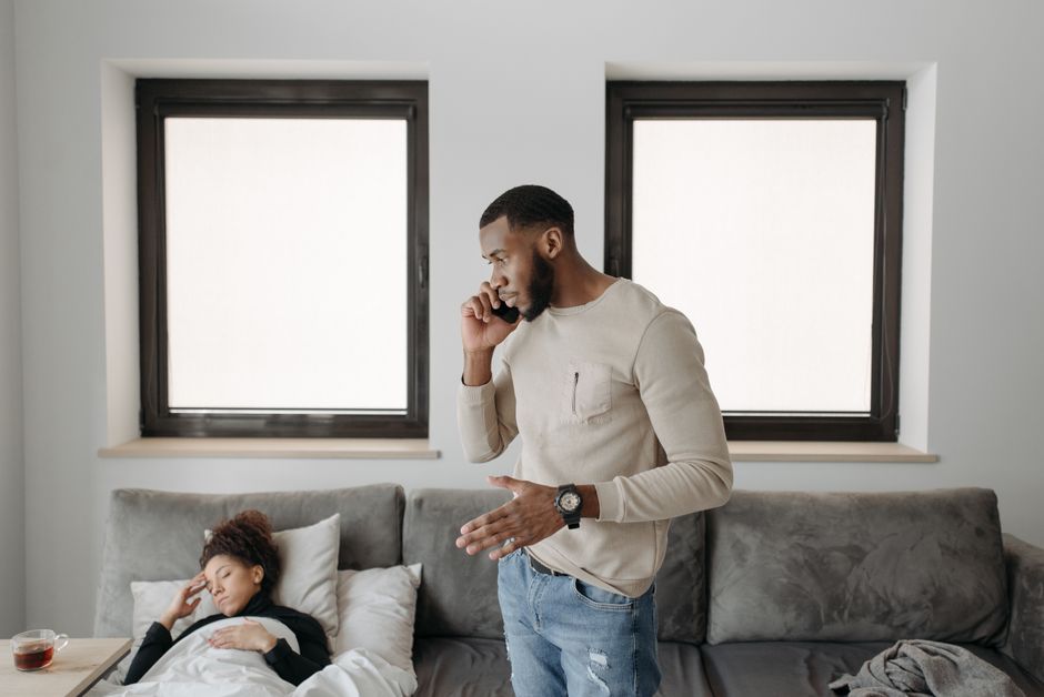person making urgent phone call at home
