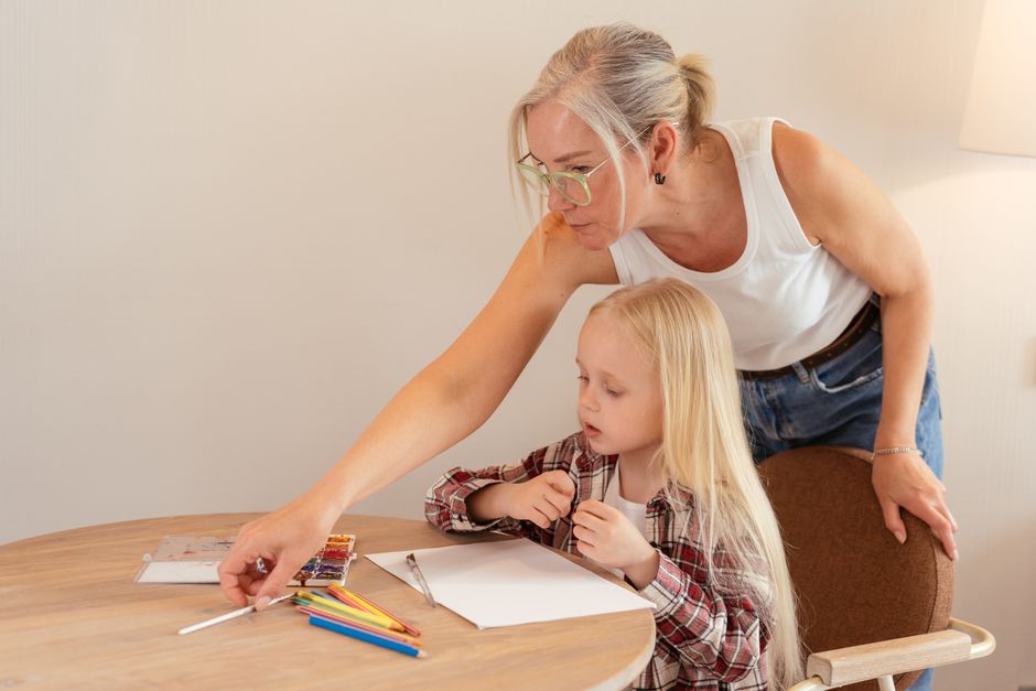 elderly woman helping children school