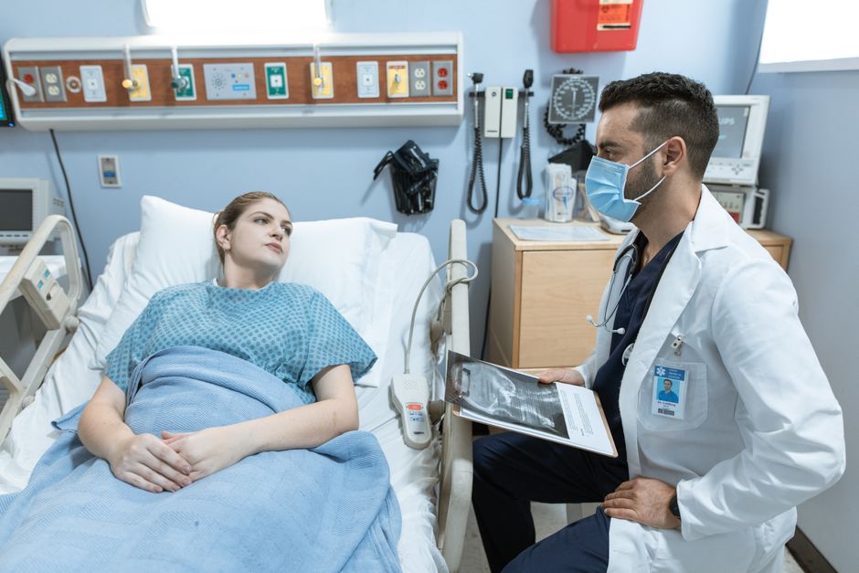 doctor explaining heart health chart to patient