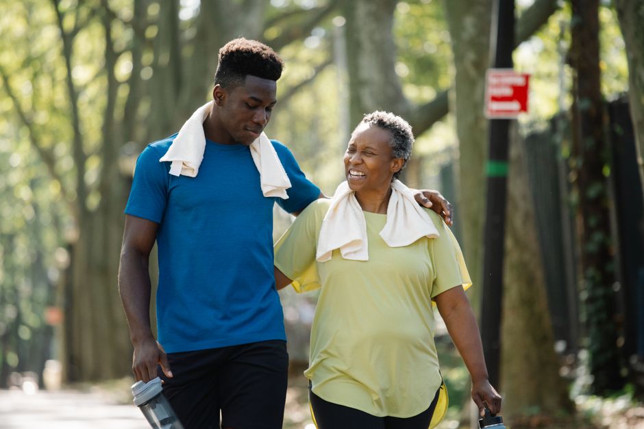 elderly people exercising walking together