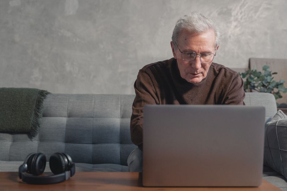 korean elderly person using laptop at home