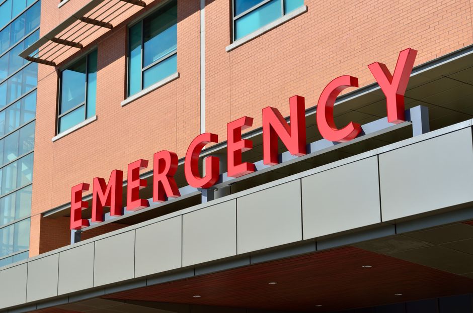 emergency room hospital entrance sign at night