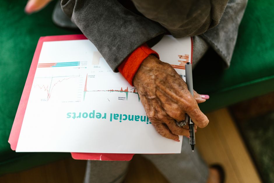 senior citizen reviewing financial documents