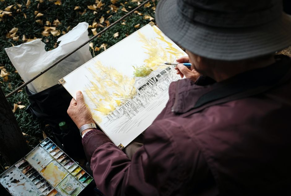 senior man painting watercolor art