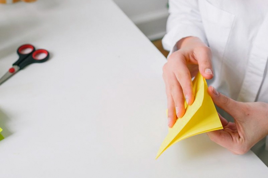 origami paper folding hands closeup