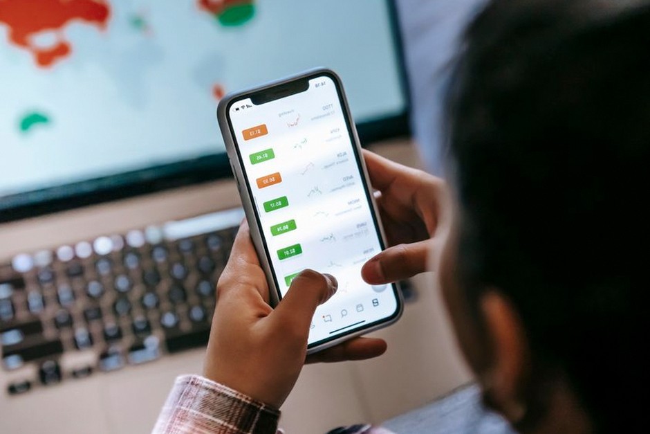 person checking stock app phone