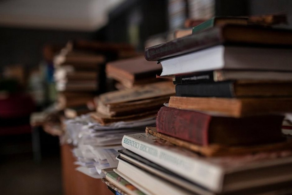 stack of books on wooden table