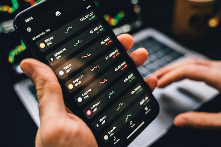 person checking stock market app phone