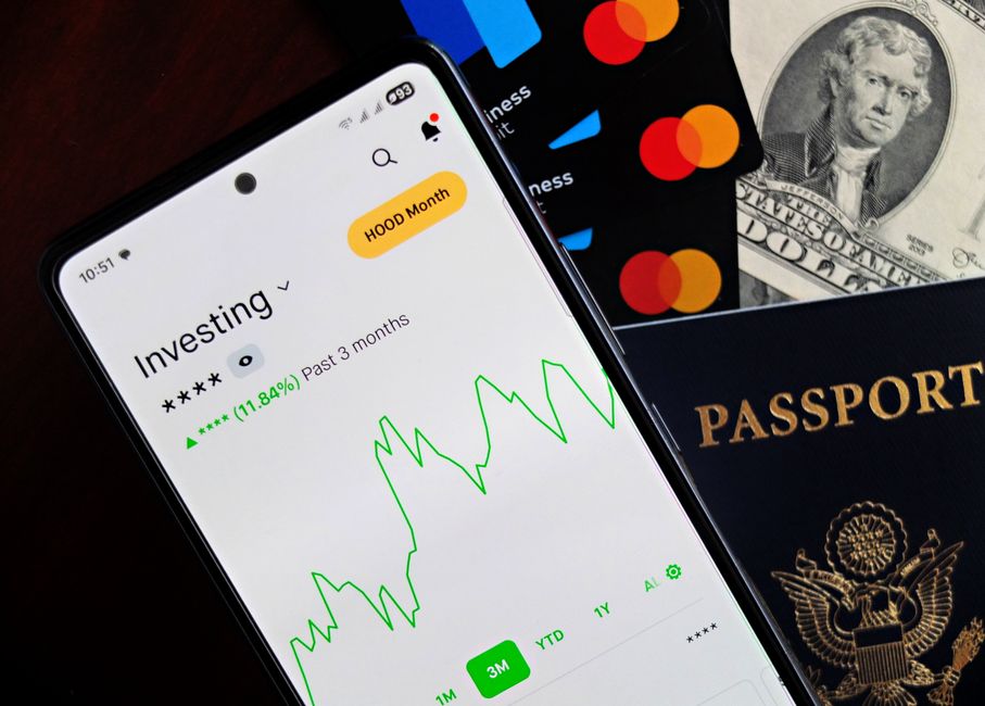 person using investment app on smartphone