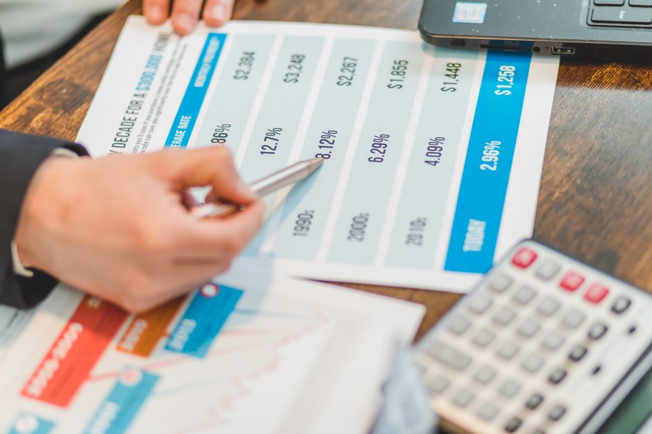 elderly person calculating interest rate