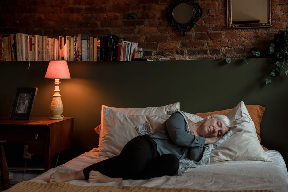 senior woman tired cannot sleep bed